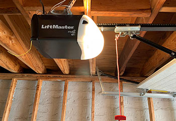 Close-up of a LiftMaster garage door opener with chain drive repaired in New Milford, CT
