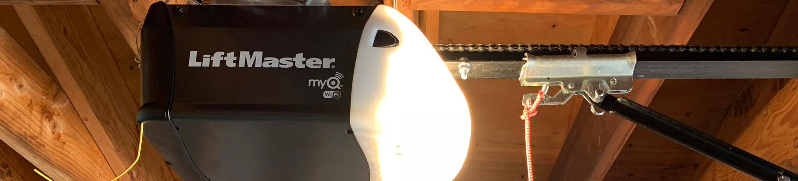 Close-up of a LiftMaster garage door opener with chain drive repaired in New Milford, CT